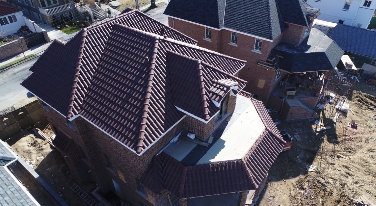 Aerial view of deep maroon mission barrel tile roof