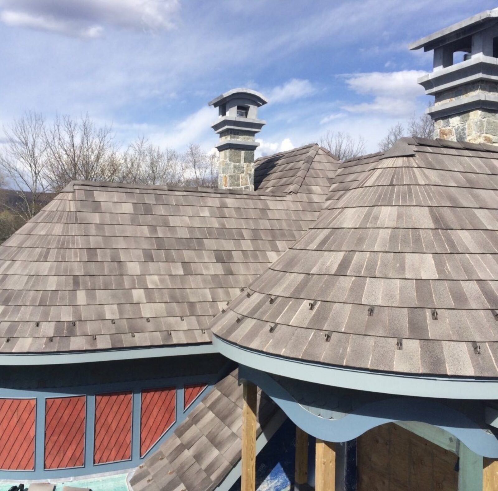 Custom home with hand-laid grey slate-shake clay tile roof