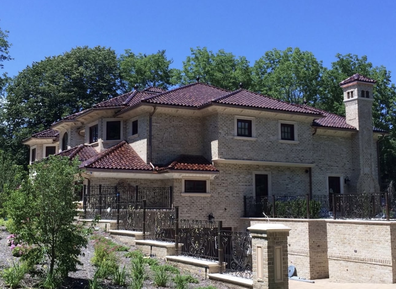 Luxury villa with vintage red mission barrel tile roof